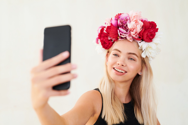 Woman with Wreath of Peonies Takes Selfie